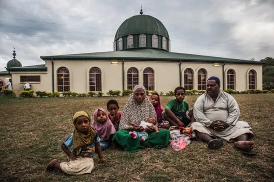 A Muslim family sitting outside a mosque in Papua New Guinea