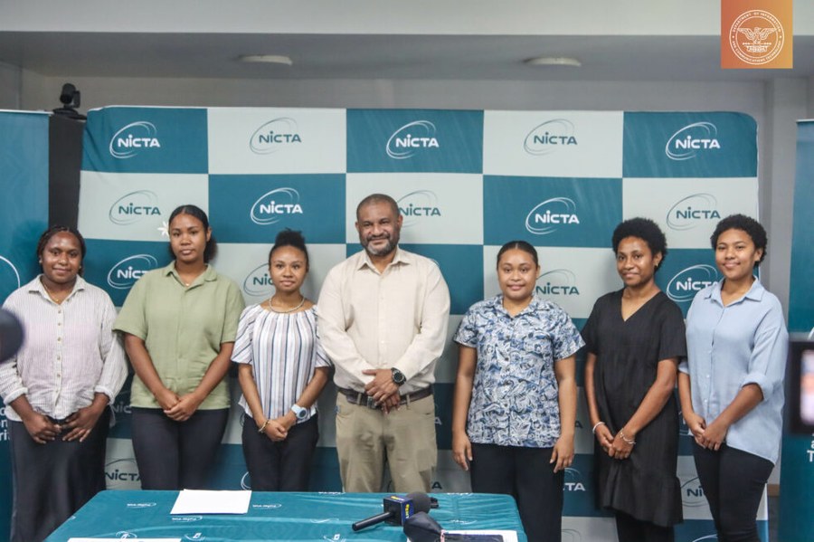 NICTA officials and Girls in ICT scholarship recipients at a press event